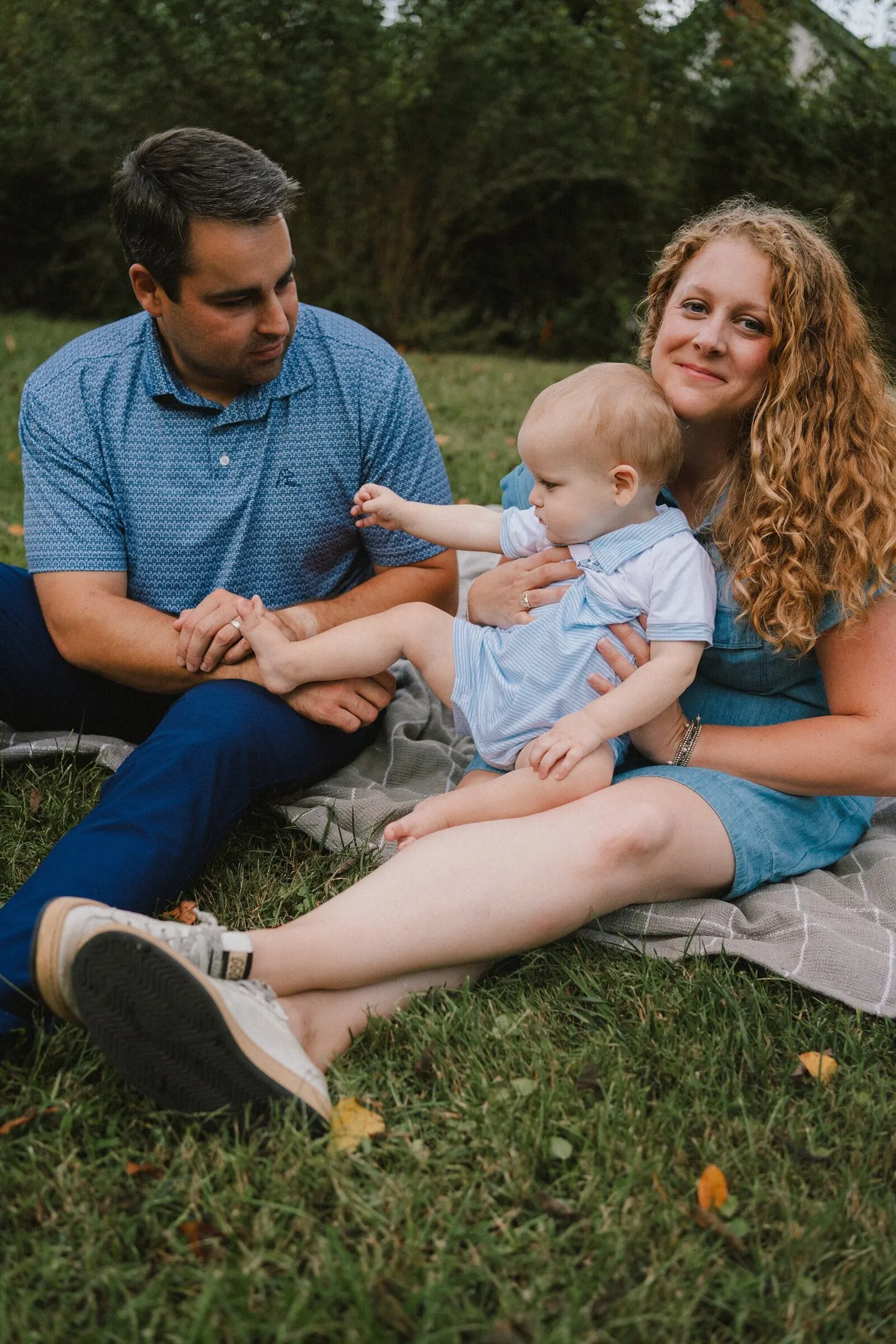 relaxed outdoor posing for family of 3 with charlottesville photographer