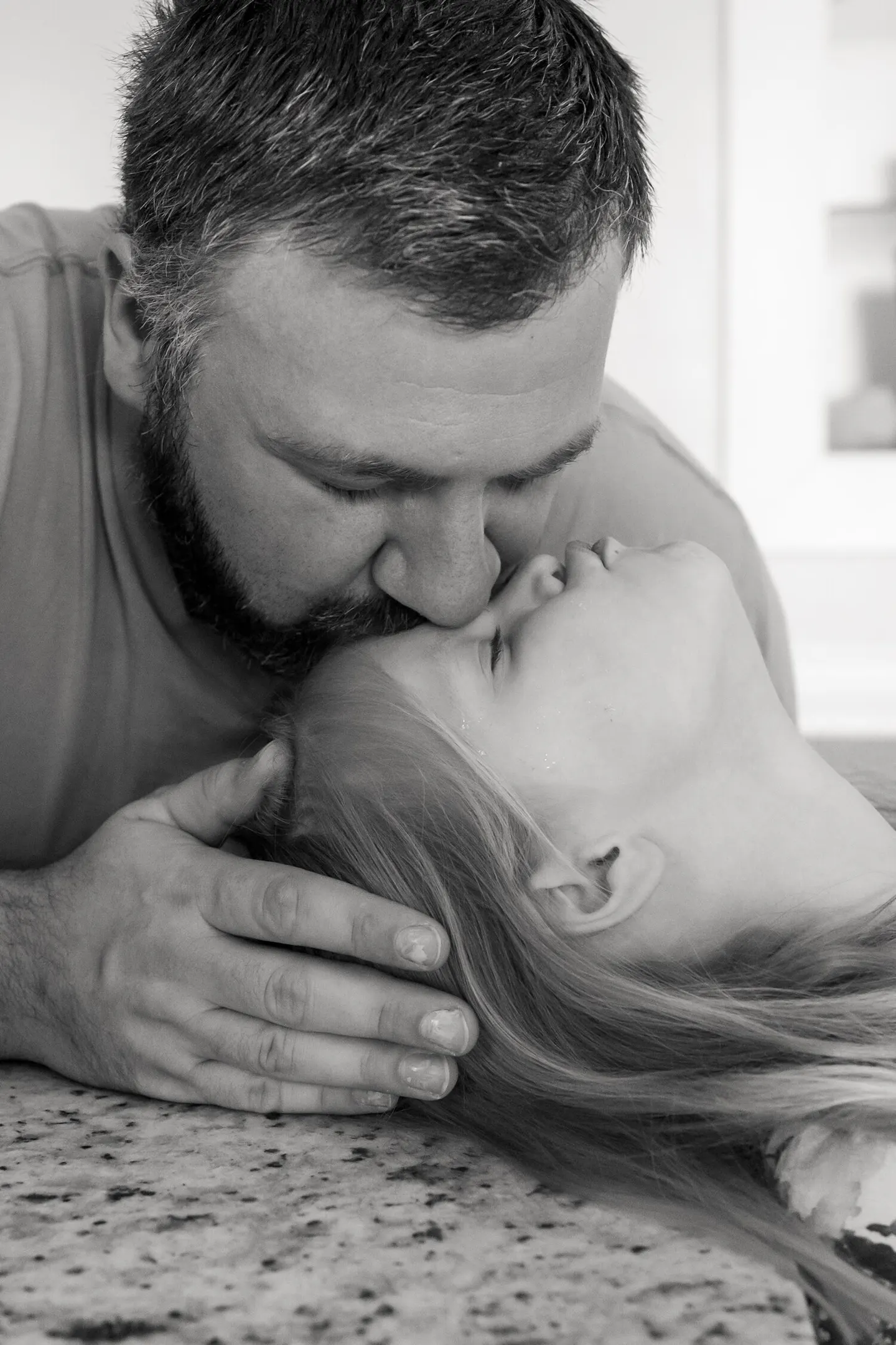 dad and daughter pose in family photo session at home with leah o'connell